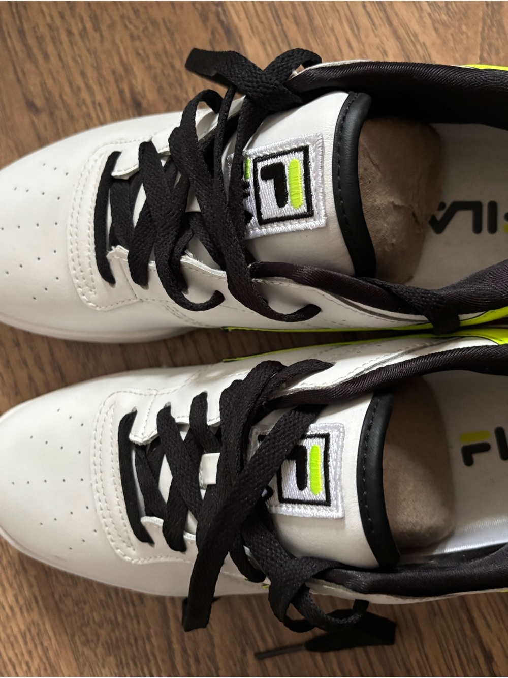 White Fila Sneakers with Black Laces and Neon Yellow Accents